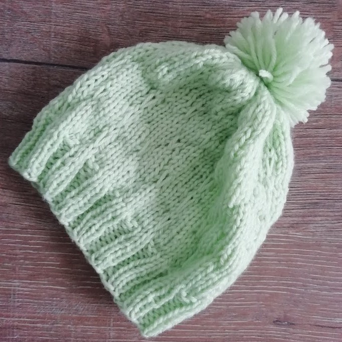 photo newborn knitted beanie light green color